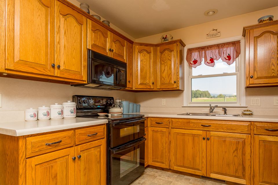 5296 Briery Branch Road Dayton, VA 22821 - Photo 13 of 45 a kitchen with stainless steel appliances granite countertop a sink and cabinets
