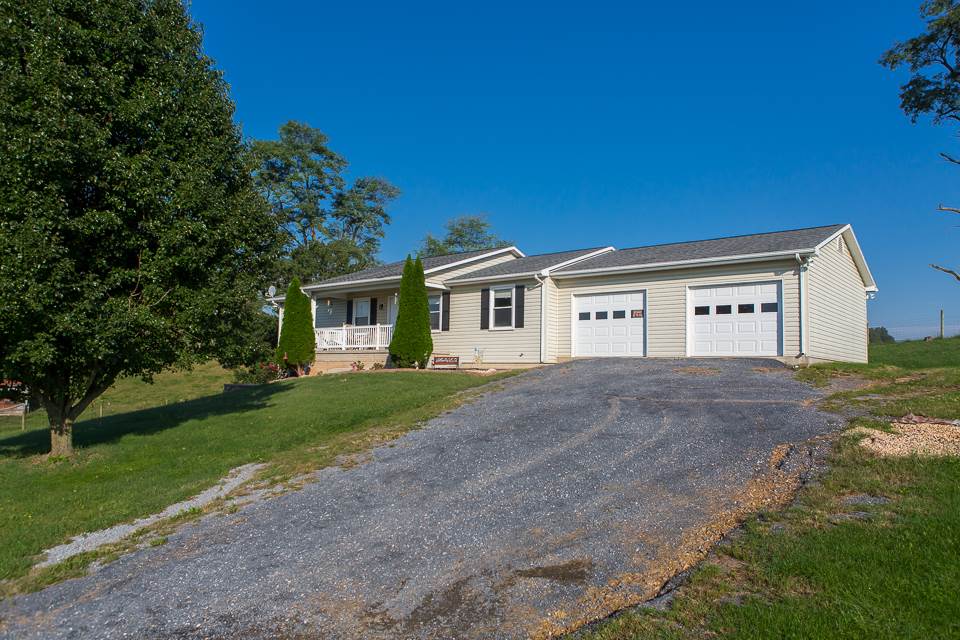 5296 Briery Branch Road Dayton, VA 22821 - Photo 3 of 45 a view of a white house with a big yard and large trees
