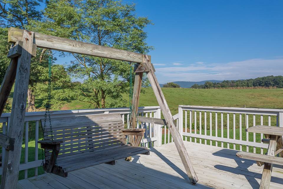 5296 Briery Branch Road Dayton, VA 22821 - Photo 31 of 45 a view of a deck with wooden floor and outdoor seating