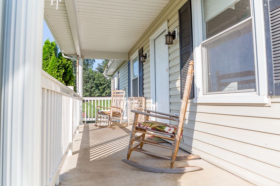 5296 Briery Branch Road Dayton, VA 22821 - Photo 5 of 45 a balcony view with outdoor seating and plants