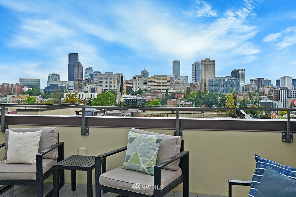 933 16th Avenue, Unit A Seattle, WA 98122 - Photo 1 of 19 a view of a city with lawn chairs
