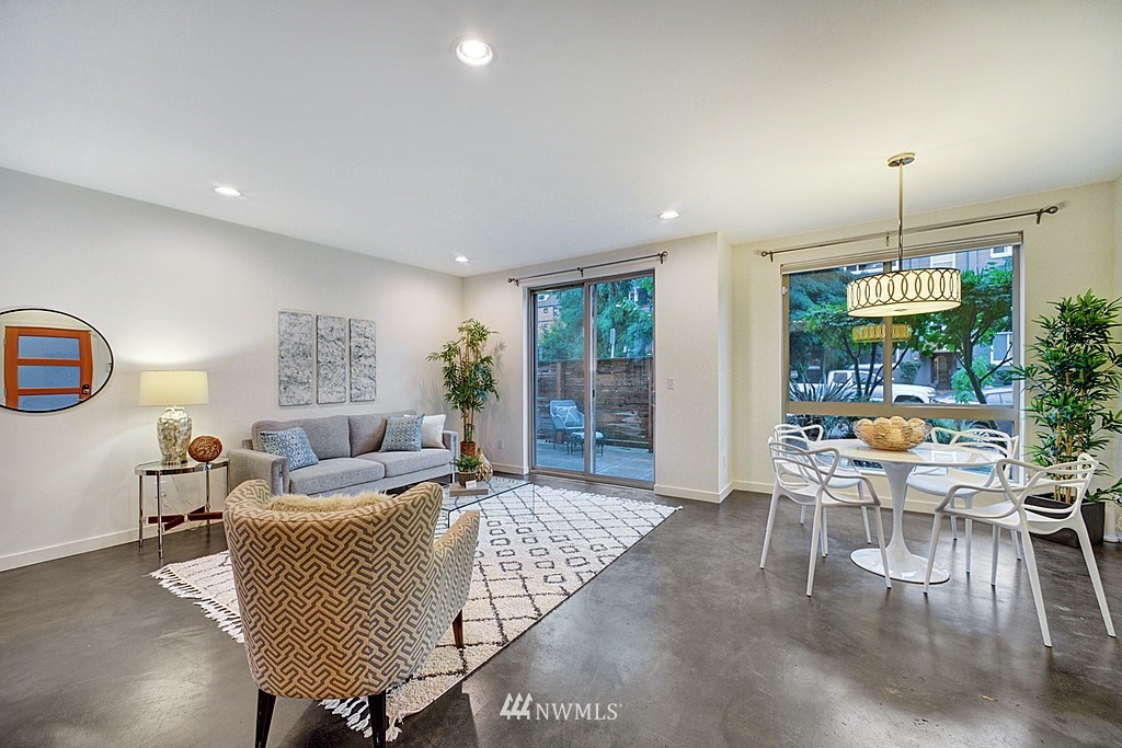 933 16th Avenue, Unit A Seattle, WA 98122 - Photo 5 of 19 a living room with furniture and a wooden floor