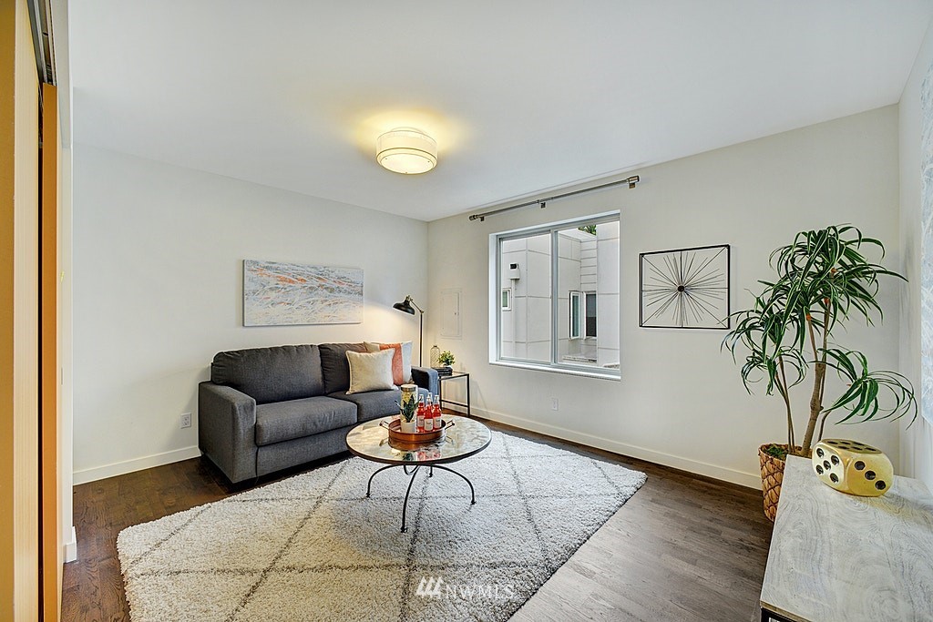 933 16th Avenue, Unit A Seattle, WA 98122 - Photo 10 of 19 a living room with furniture and a potted plant
