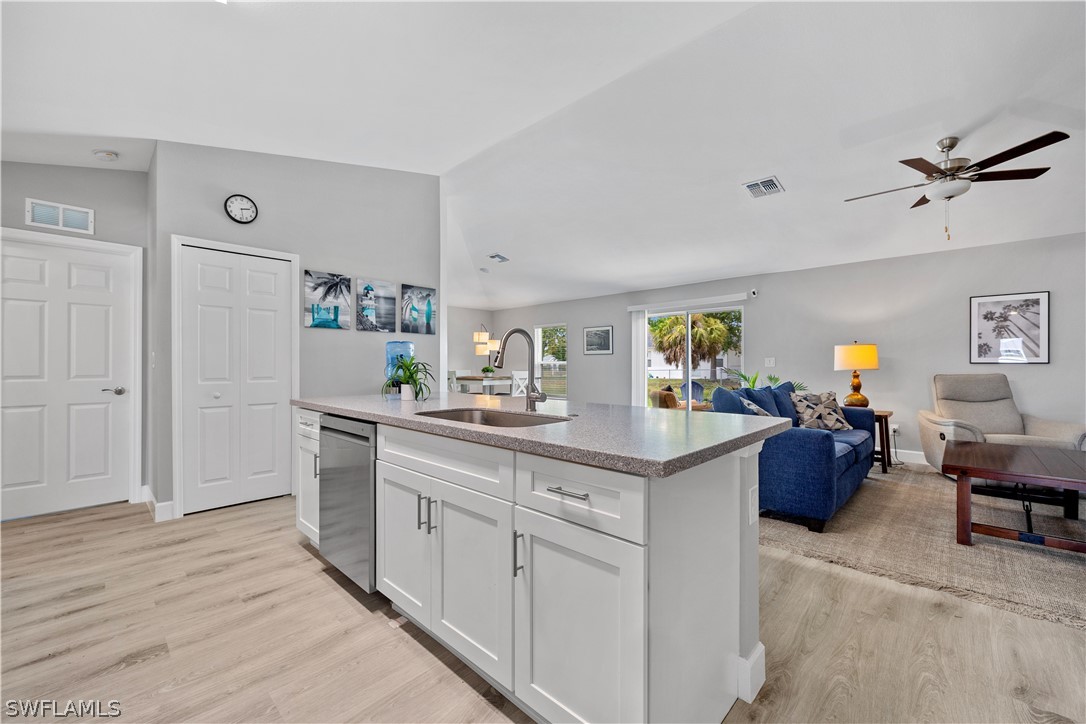 16582 Becasse Drive Punta Gorda, FL 33955 - Photo 11 of 32 a kitchen with a sink and cabinets