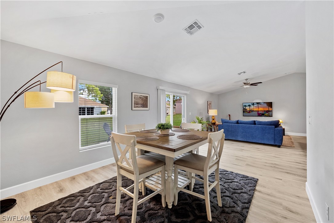 16582 Becasse Drive Punta Gorda, FL 33955 - Photo 13 of 32 a view of a dining room with furniture and window
