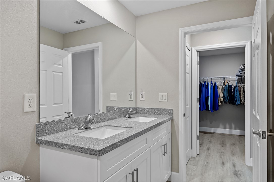 16582 Becasse Drive Punta Gorda, FL 33955 - Photo 17 of 32 a bathroom with a sink and a mirror