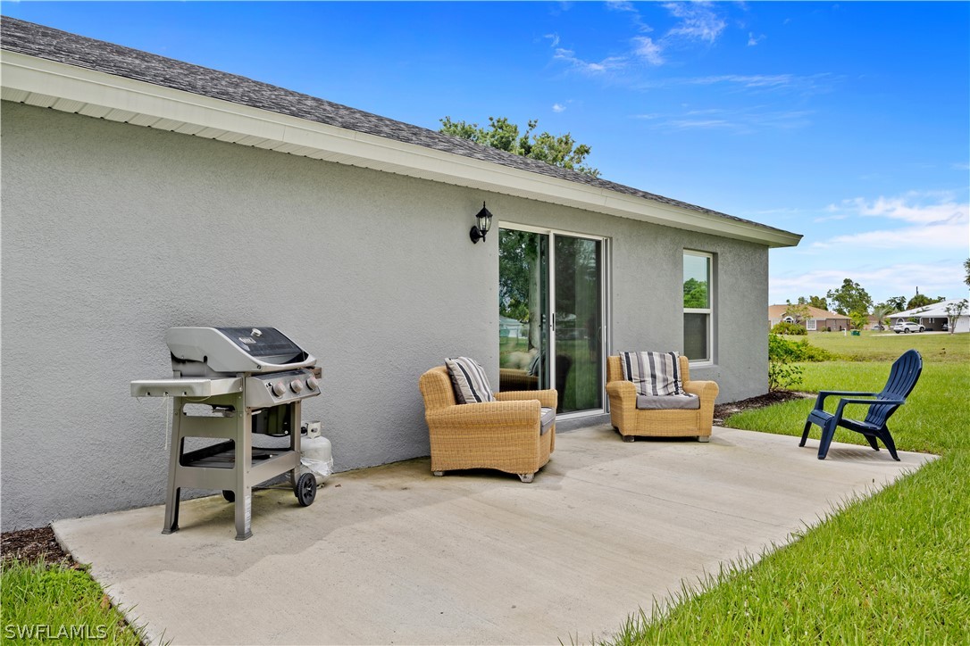 16582 Becasse Drive Punta Gorda, FL 33955 - Photo 22 of 32 a backyard of a house with seating space