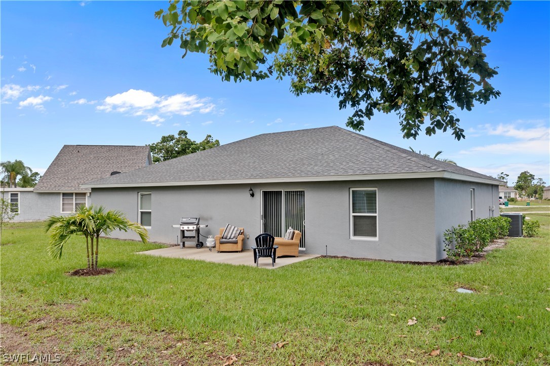 16582 Becasse Drive Punta Gorda, FL 33955 - Photo 26 of 32 a backyard of a house with table and chairs