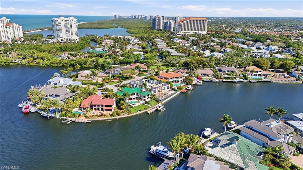 310 Pirates Bight Naples, FL 34103 - Photo 13 of 16 an aerial view of a house with a lake view