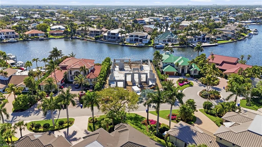 310 Pirates Bight Naples, FL 34103 - Photo 3 of 16 an aerial view of lake and residential houses with outdoor space