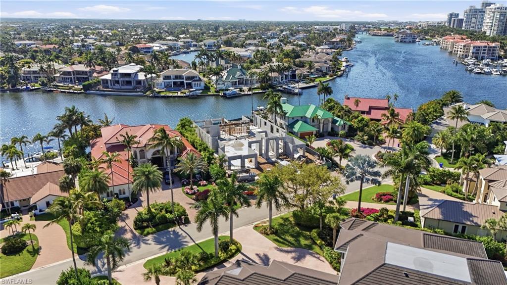 310 Pirates Bight Naples, FL 34103 - Photo 4 of 16 an aerial view of residential houses with outdoor space and lake view