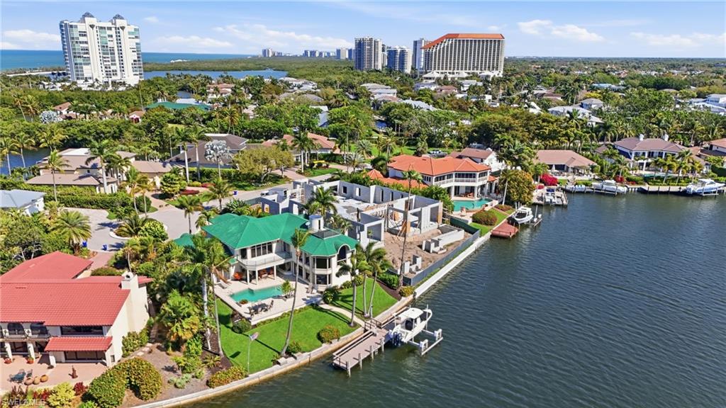 310 Pirates Bight Naples, FL 34103 - Photo 10 of 16 an aerial view of multiple houses with yard