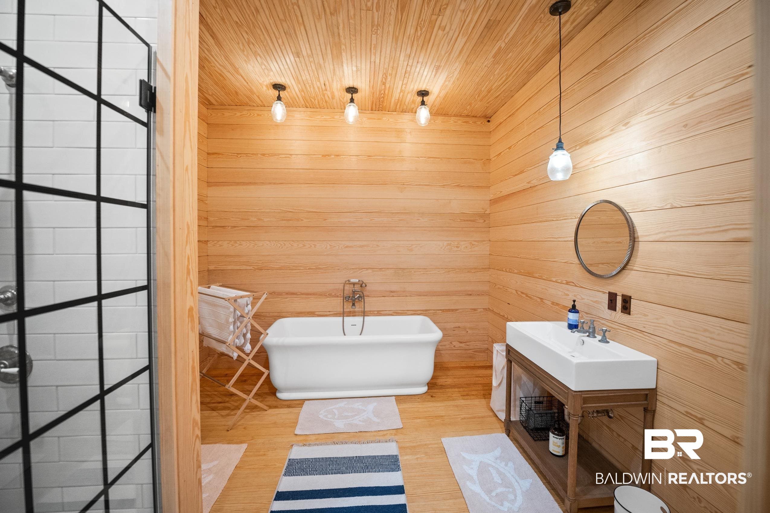 30671 Magnolia Street Elberta, AL 36530 - Photo 53 of 68 Bathroom featuring a freestanding bath, a sink, wooden ceiling, and wooden walls