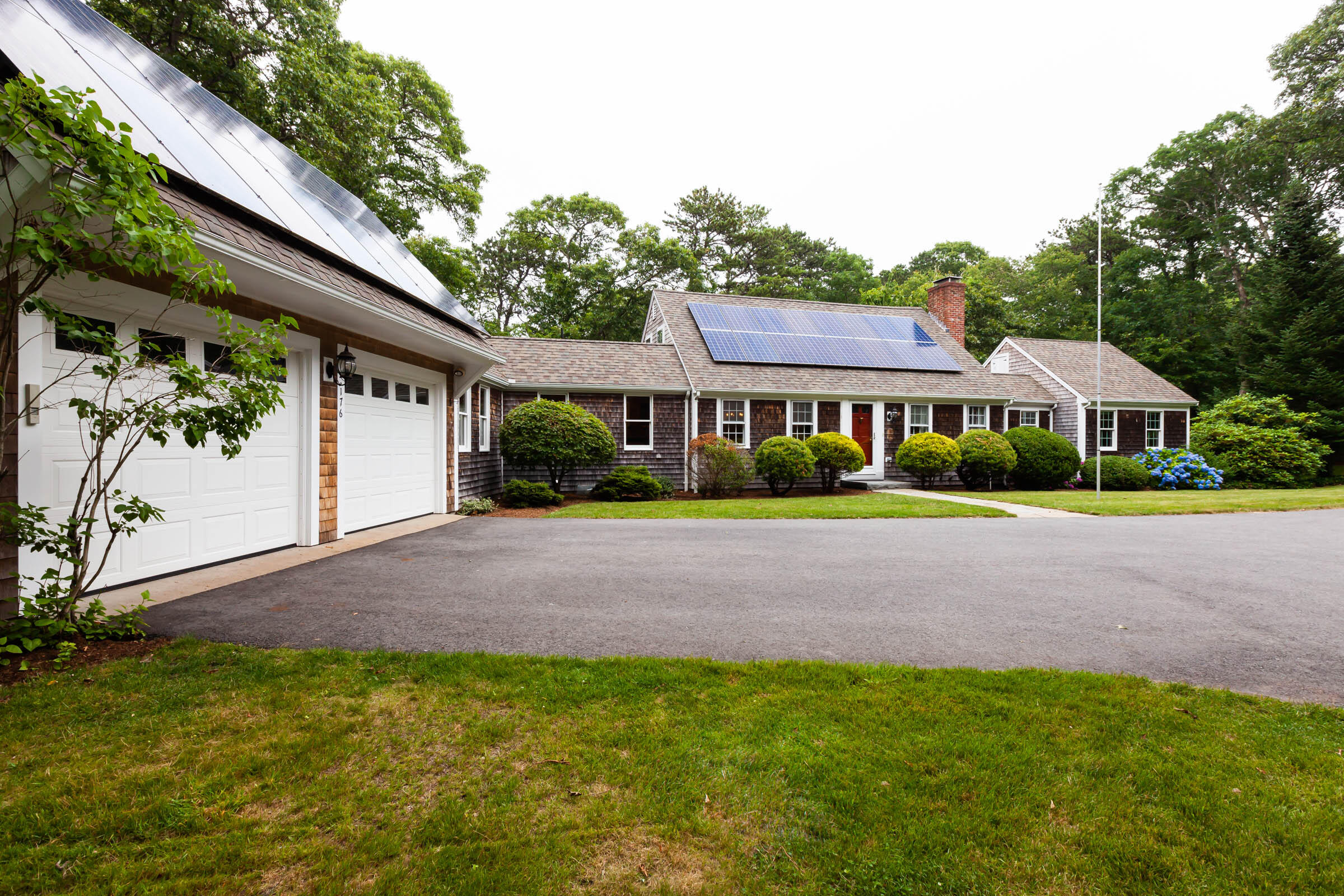 a view of an house with swimming pool yard and outdoor seating