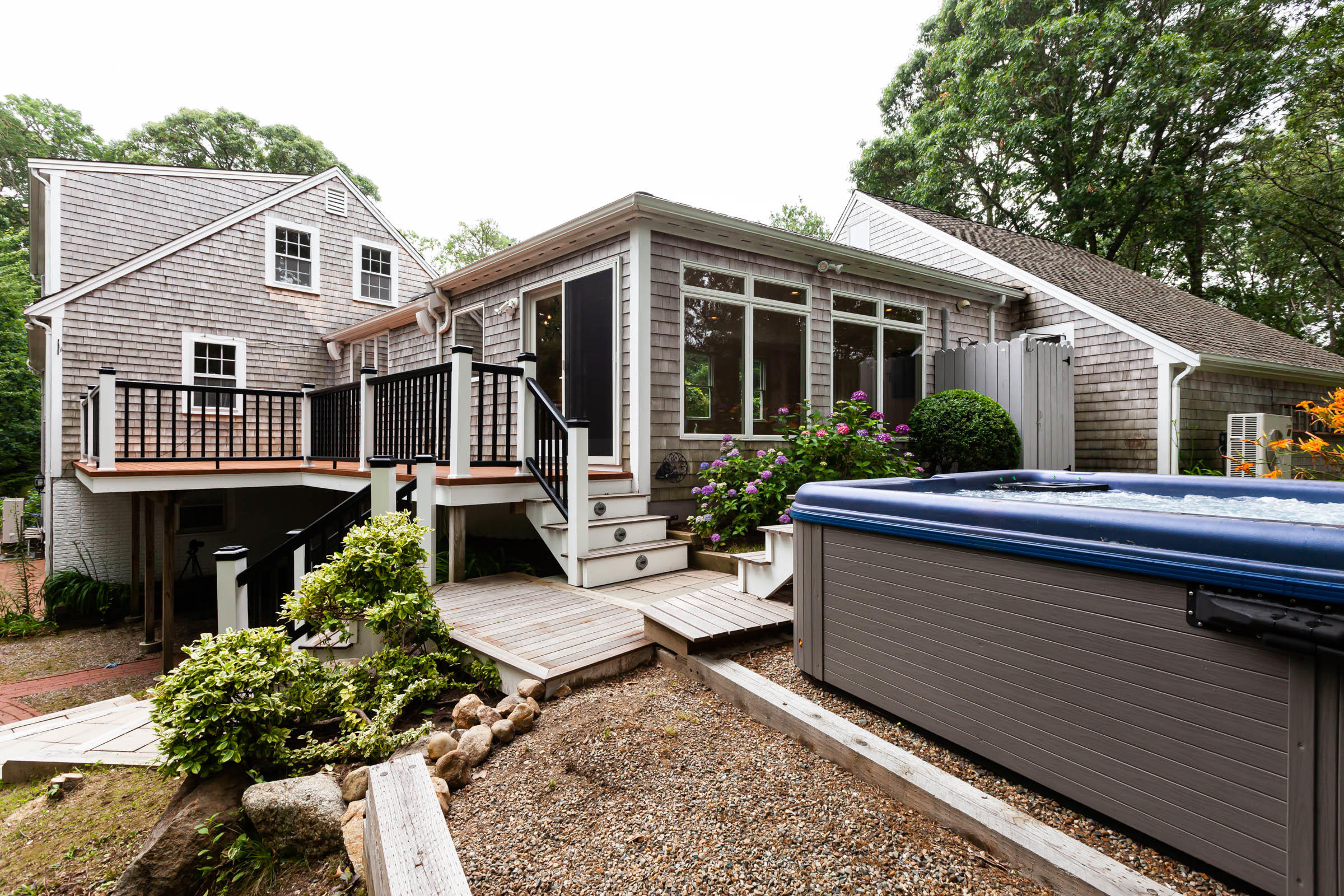 176 Monument Road Orleans, MA 02653 - Photo 14 of 55 a view of a house with a small yard and sitting area