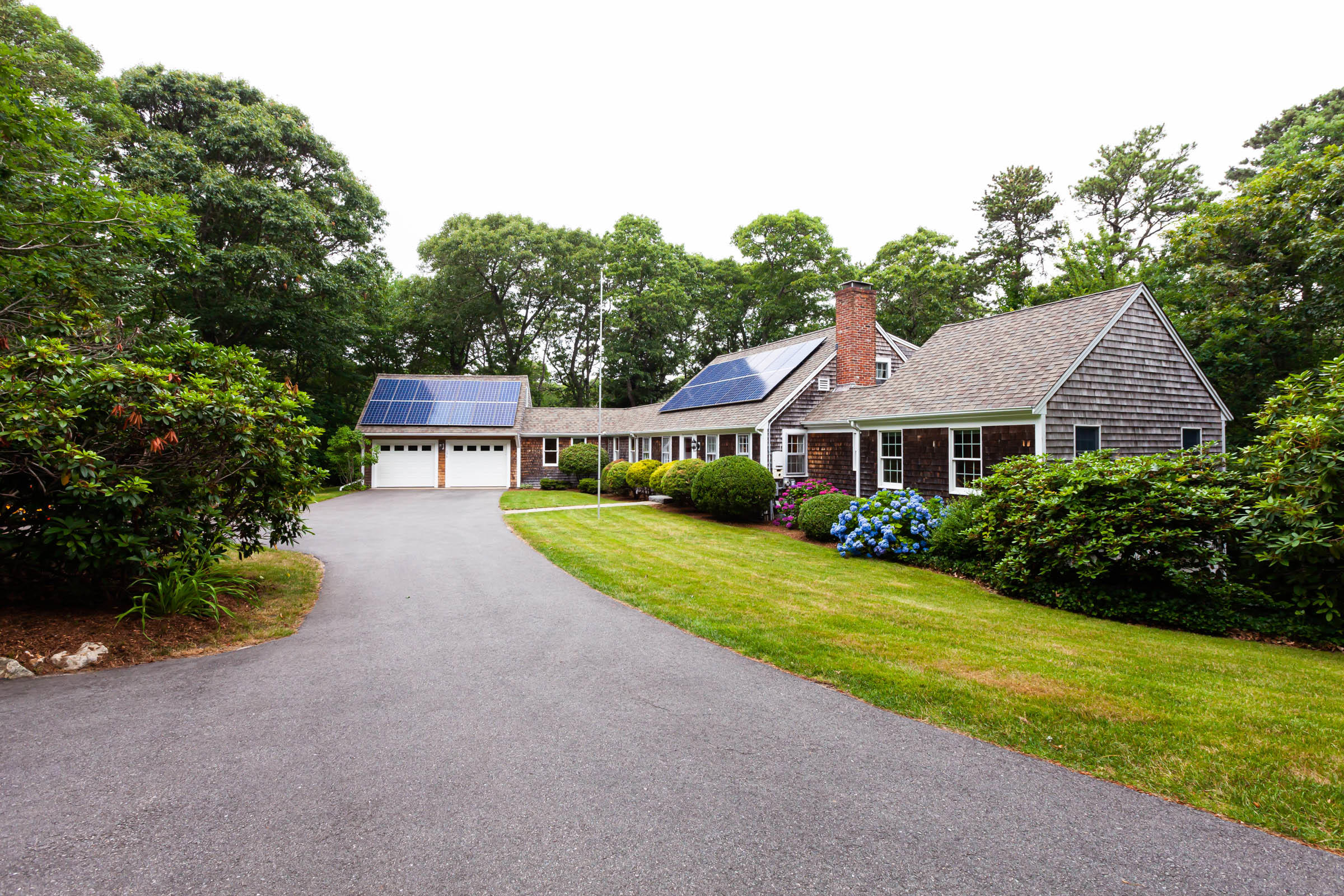 176 Monument Road Orleans, MA 02653 - Photo 2 of 55 a front view of a house with garden