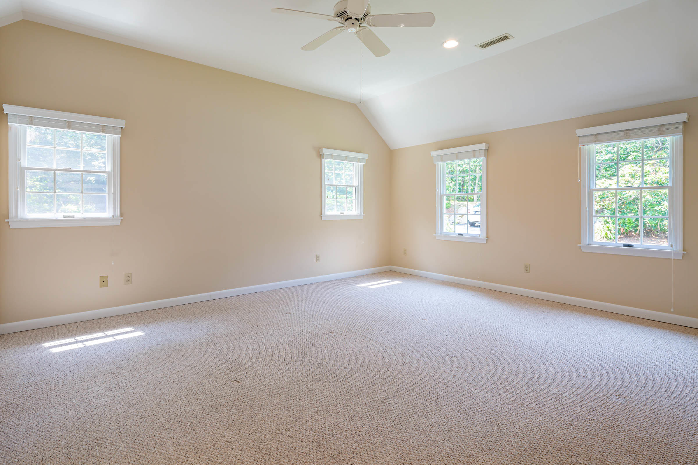 176 Monument Road Orleans, MA 02653 - Photo 23 of 55 an empty room with a window and a ceiling fan