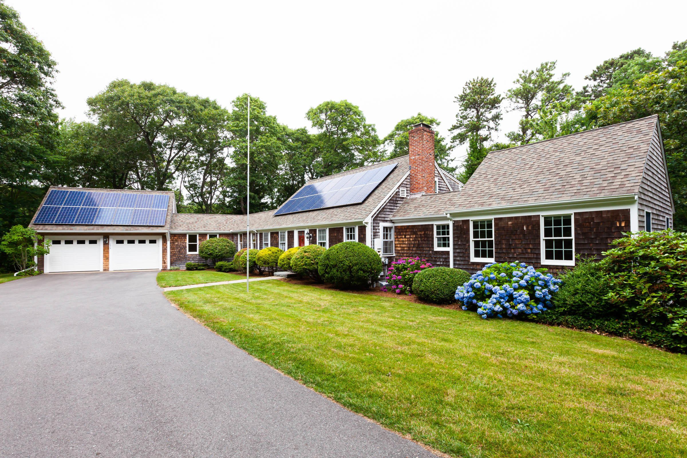 176 Monument Road Orleans, MA 02653 - Photo 3 of 55 a front view of a house with garden