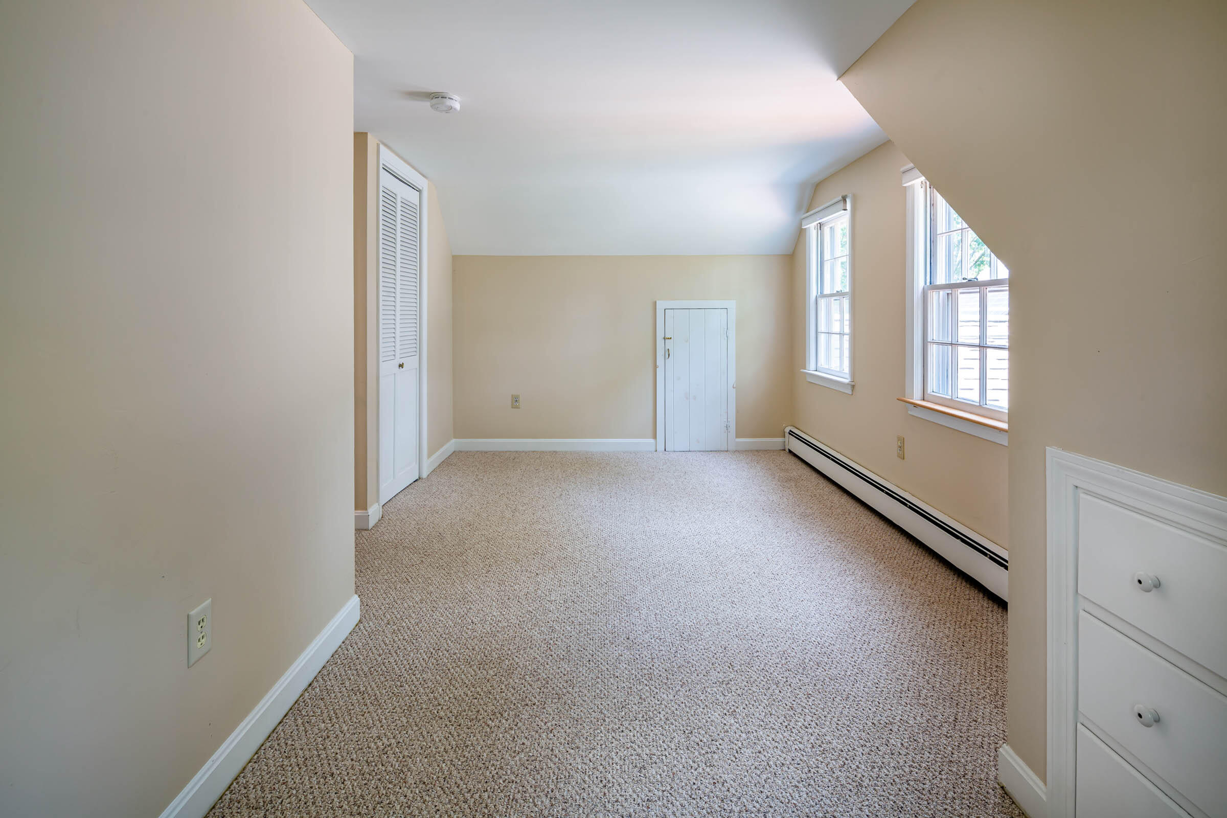 176 Monument Road Orleans, MA 02653 - Photo 31 of 55 an empty room with windows and closet