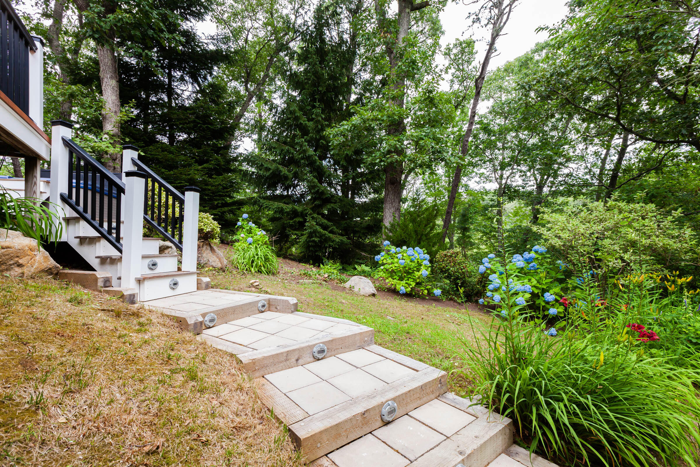 176 Monument Road Orleans, MA 02653 - Photo 44 of 55 a view of a house with backyard and trees