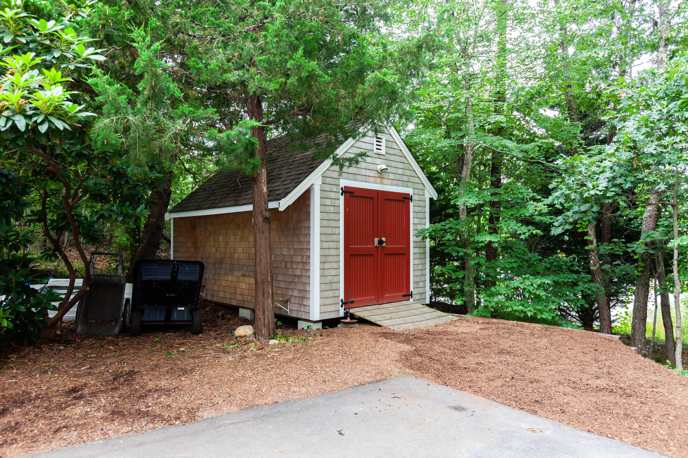 176 Monument Road Orleans, MA 02653 - Photo 48 of 55 a view of a house and a yard