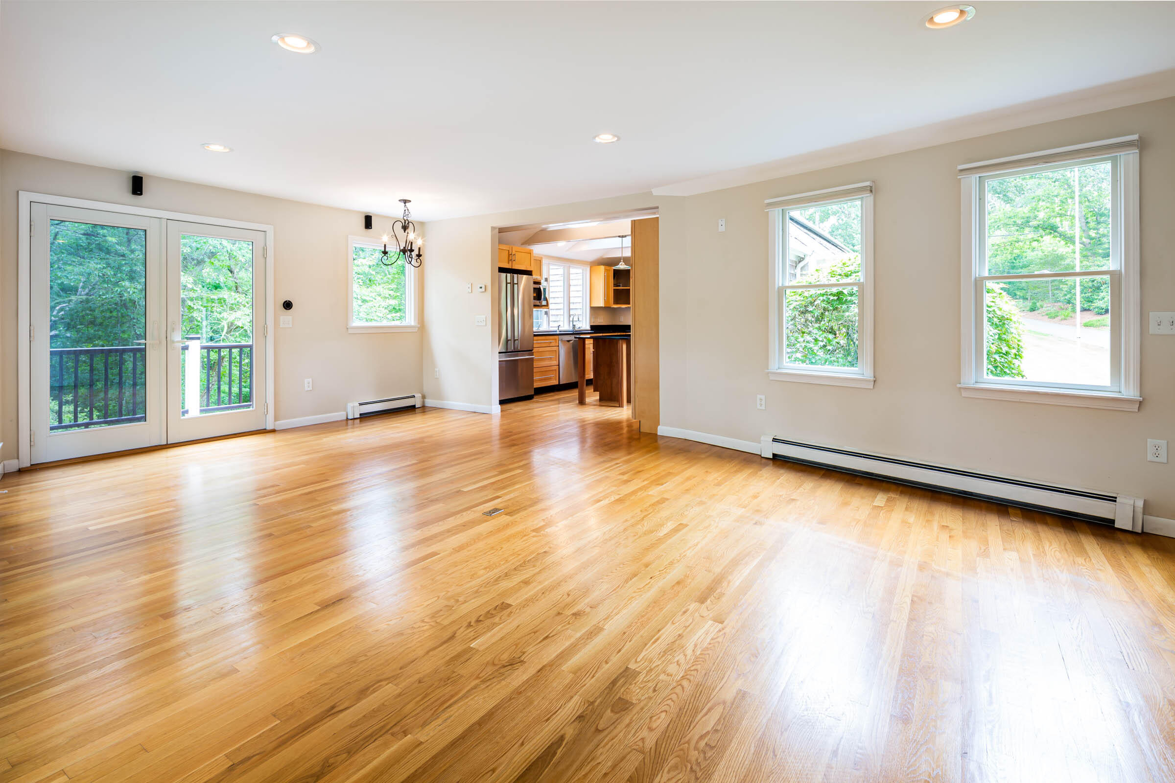 176 Monument Road Orleans, MA 02653 - Photo 10 of 55 a view of an empty room with wooden floor and a window