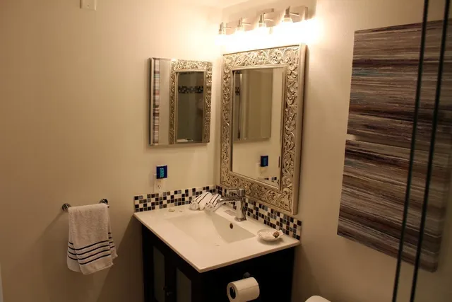 a bathroom with a sink and a mirror