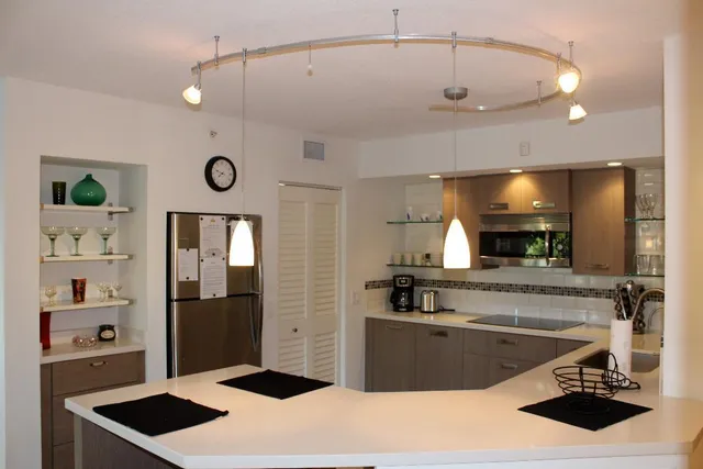 a kitchen with a sink and a stove