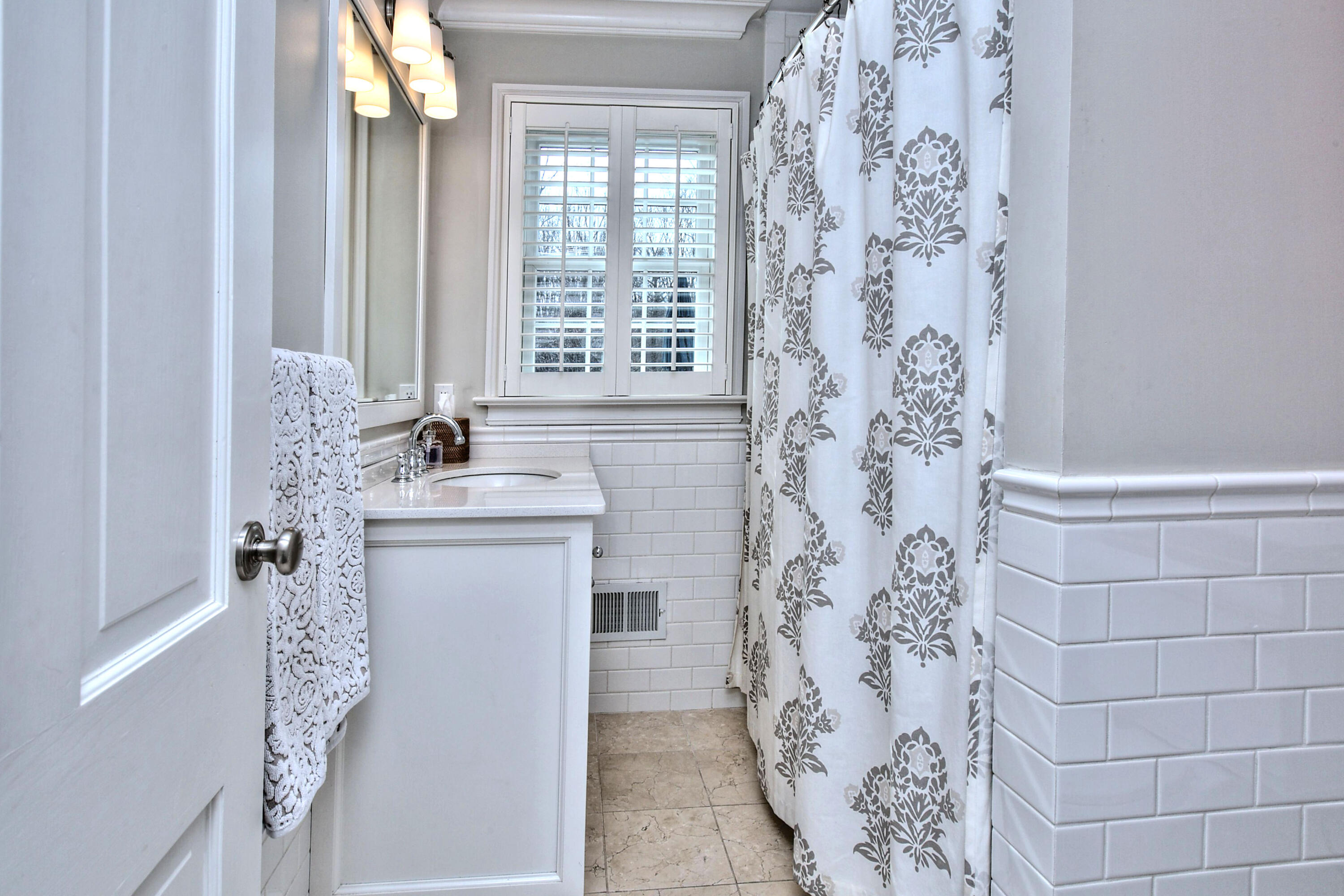 128 Dunning Road New Canaan, CT 06840 - Photo 32 of 49 a bathroom with a sink and a mirror