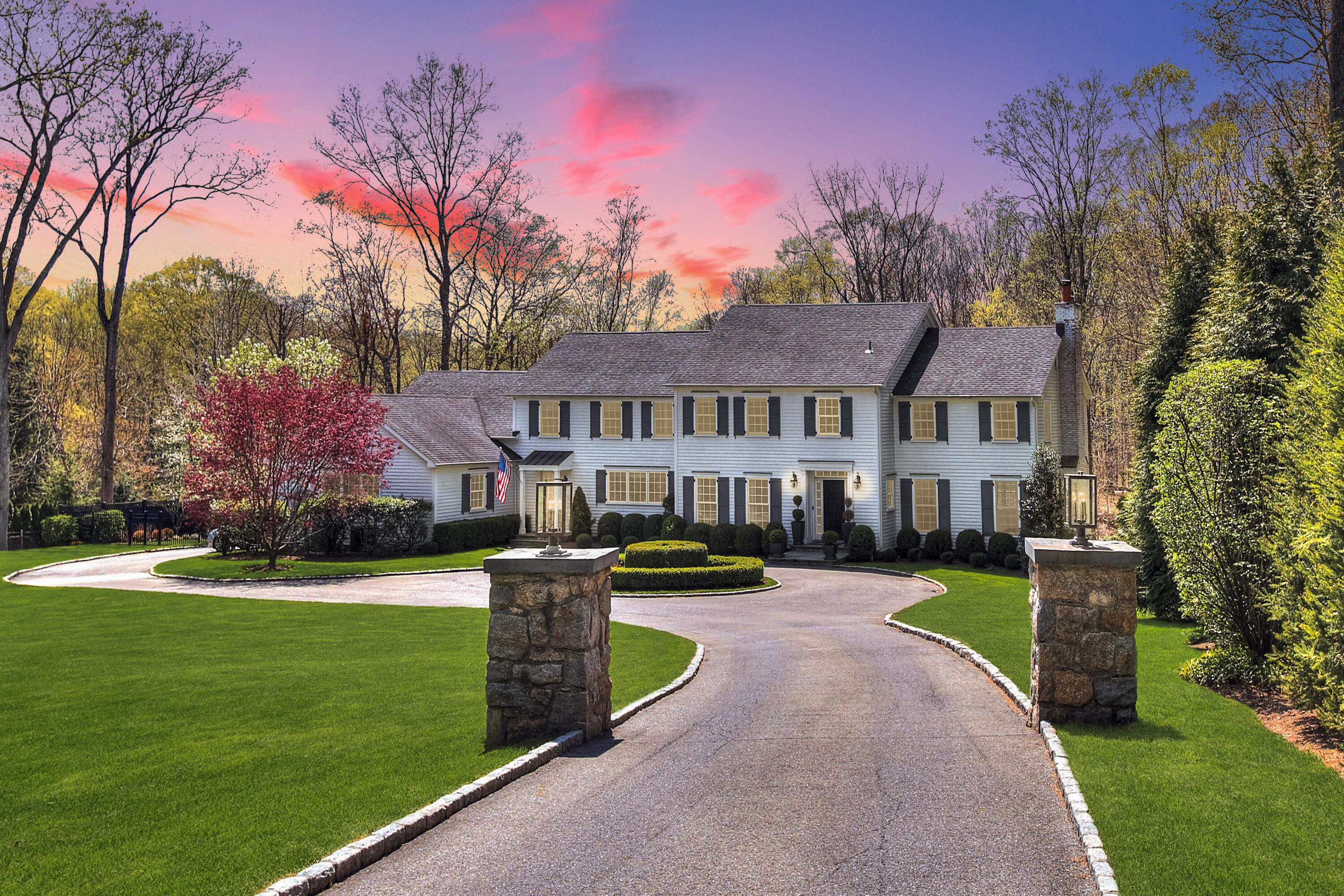 128 Dunning Road New Canaan, CT 06840 - Photo 47 of 49 a view of a house with a yard fire pit and a patio