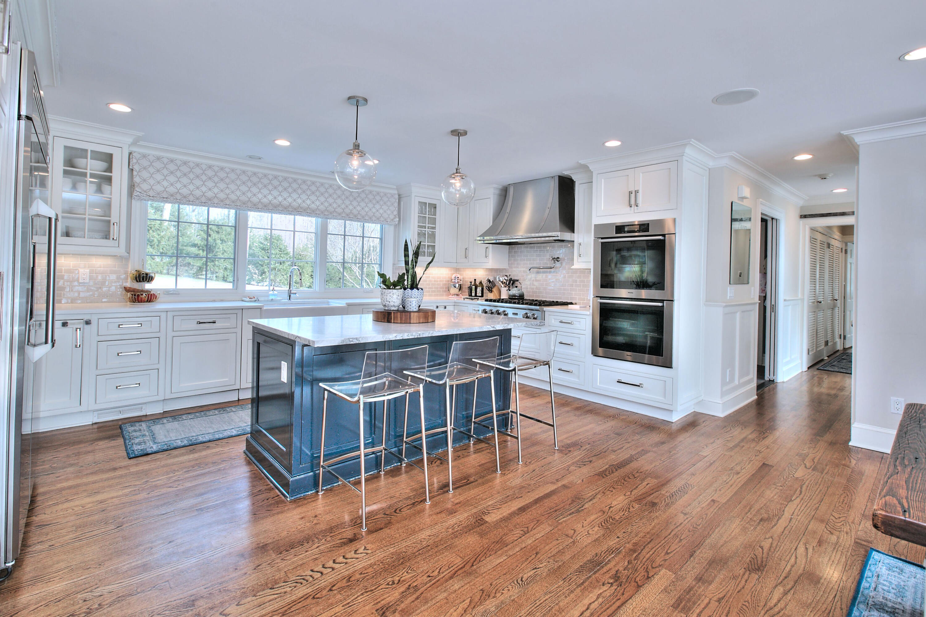128 Dunning Road New Canaan, CT 06840 - Photo 8 of 49 a kitchen with stainless steel appliances granite countertop a table chairs refrigerator and a sink