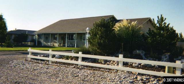 4175 Raven Drive Fallon, NV 89406 - Photo 1 of 9 a view of a house with a yard and sitting area