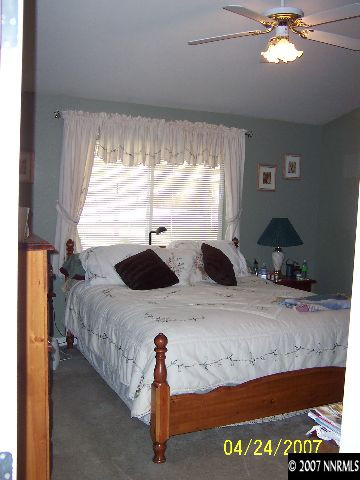 4175 Raven Drive Fallon, NV 89406 - Photo 3 of 9 a bedroom with a bed and a large window