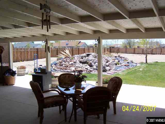4175 Raven Drive Fallon, NV 89406 - Photo 8 of 9 a view of a porch with furniture and a yard