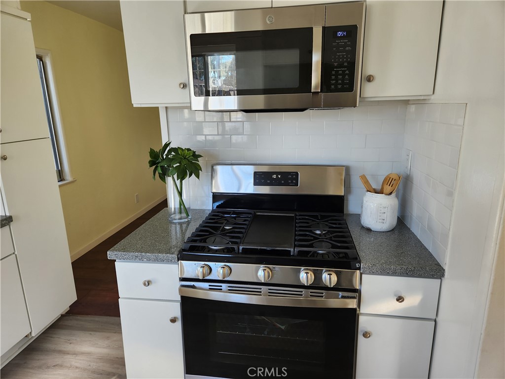 5301 Aldrich Road South Gate, CA 90280 - Photo 3 of 7 a kitchen with a stove and microwave