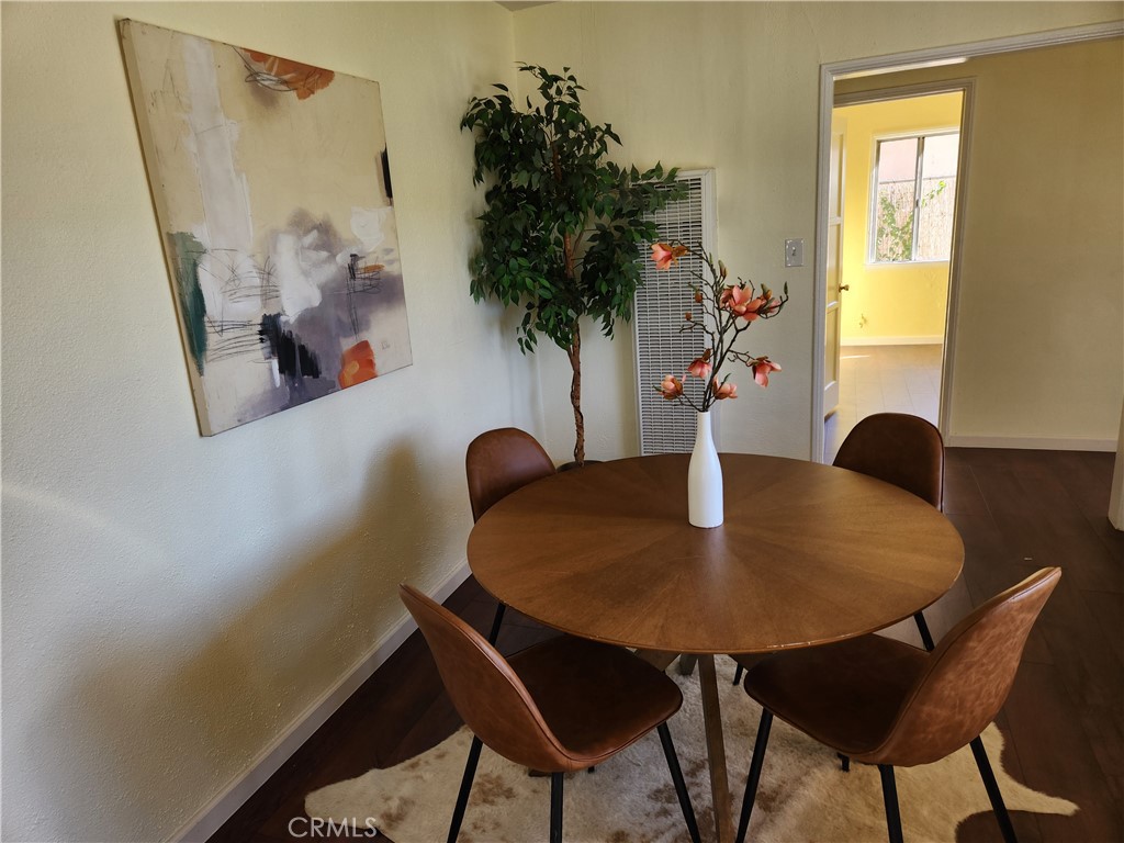5301 Aldrich Road South Gate, CA 90280 - Photo 5 of 7 a table with chairs and a potted plant