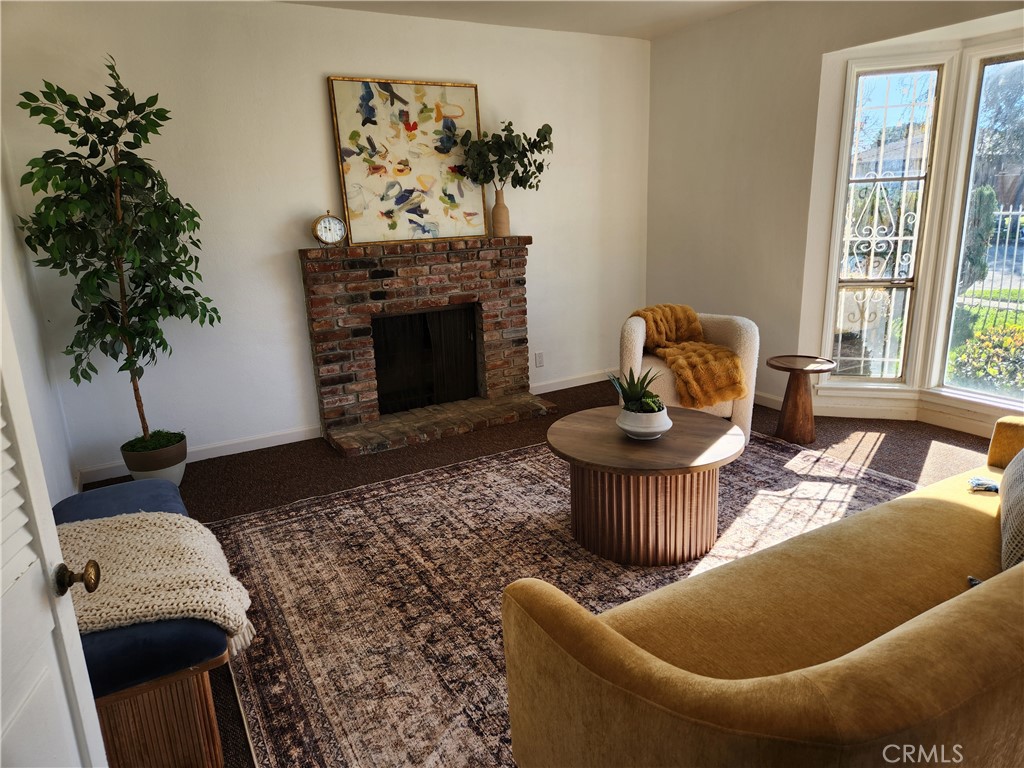 5301 Aldrich Road South Gate, CA 90280 - Photo 6 of 7 a living room with furniture and a fireplace