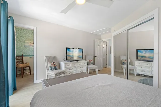 a balcony with table and chairs