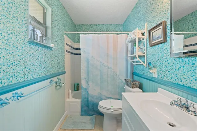 a view of a house with a yard and garage