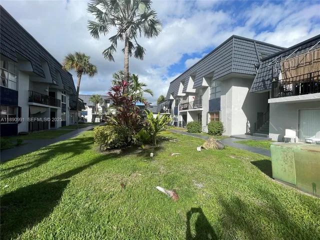 a front view of a building with garden
