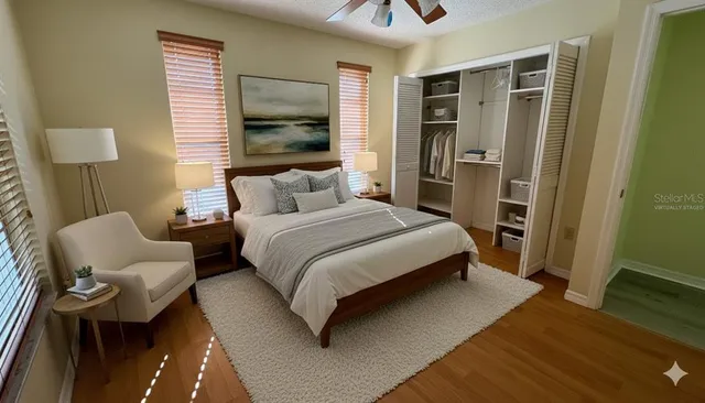 a bedroom with a bed and a couch