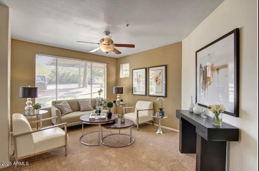 1550 East Thunderbird Road, Unit C1 Phoenix, AZ 85022 - Photo 2 of 10 a living room with furniture and a large window