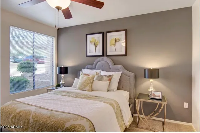 a bedroom with a bed and window