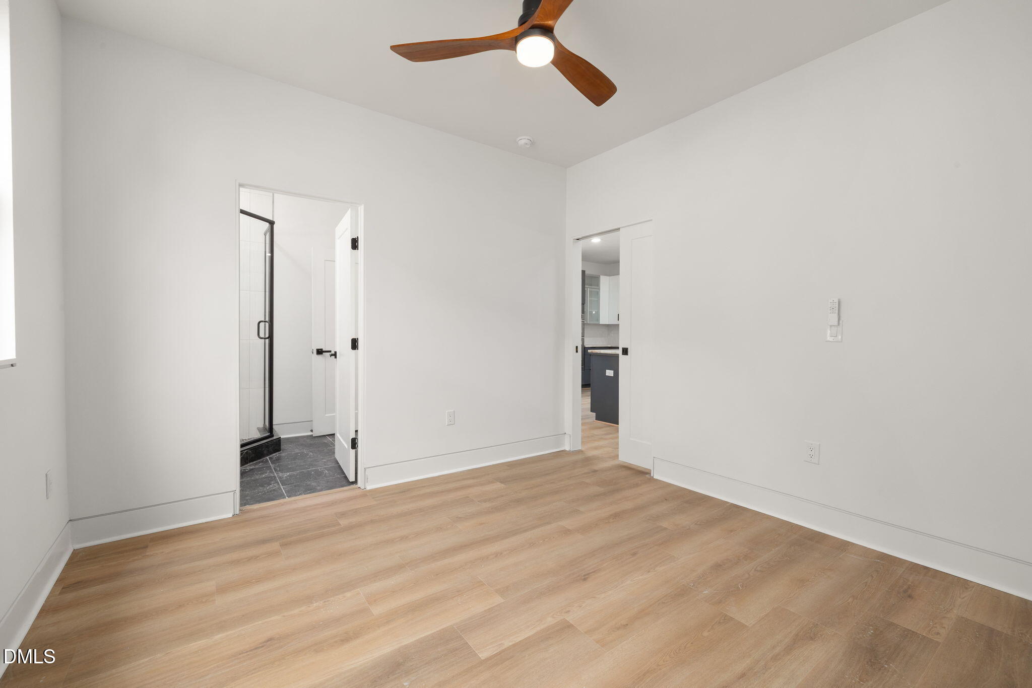 309 Bragg Street Raleigh, NC 27601 - Photo 18 of 55 an empty room with closet and a ceiling fan