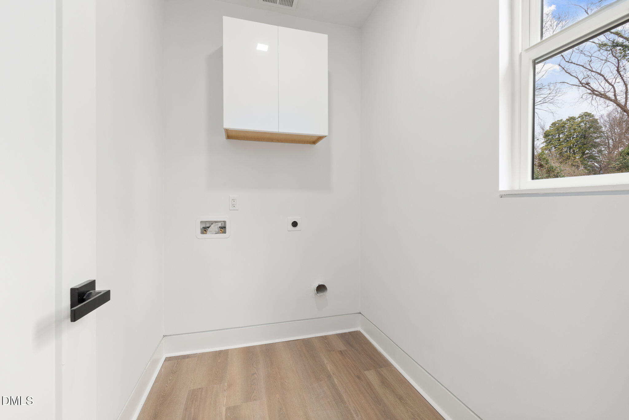 309 Bragg Street Raleigh, NC 27601 - Photo 19 of 55 a view of a small space with wooden floor and a window