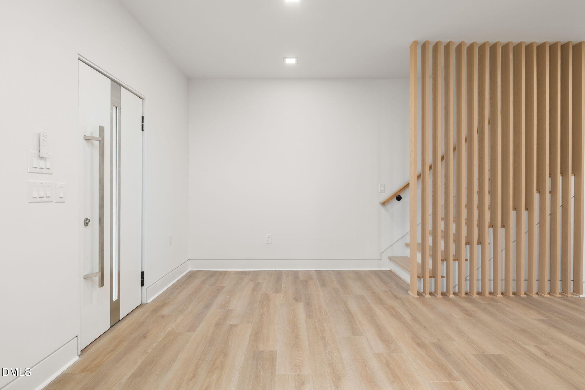 309 Bragg Street Raleigh, NC 27601 - Photo 24 of 55 a view of a room with wooden floor and a wooden wall
