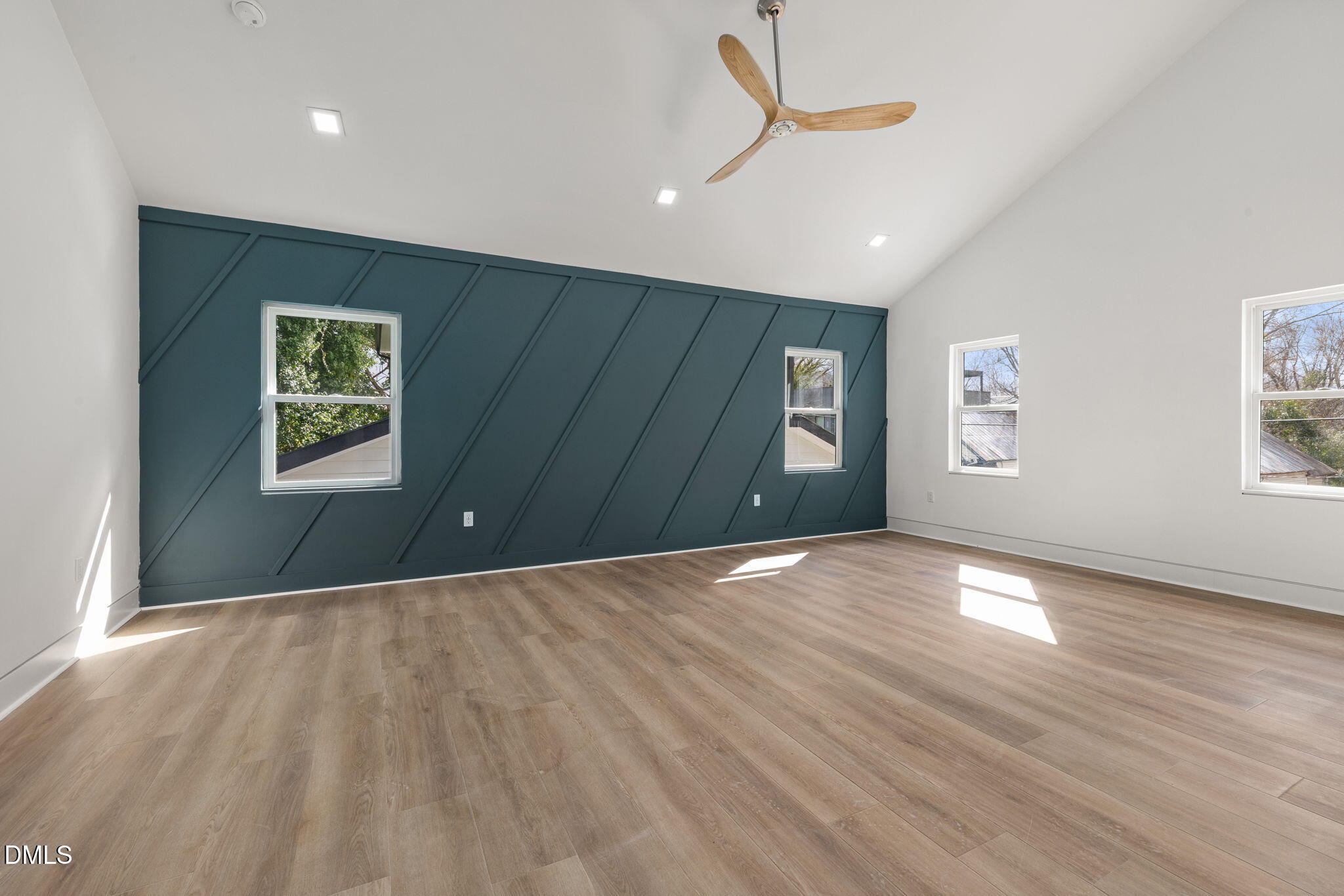 309 Bragg Street Raleigh, NC 27601 - Photo 26 of 55 a view of an empty room with a window and wooden floor