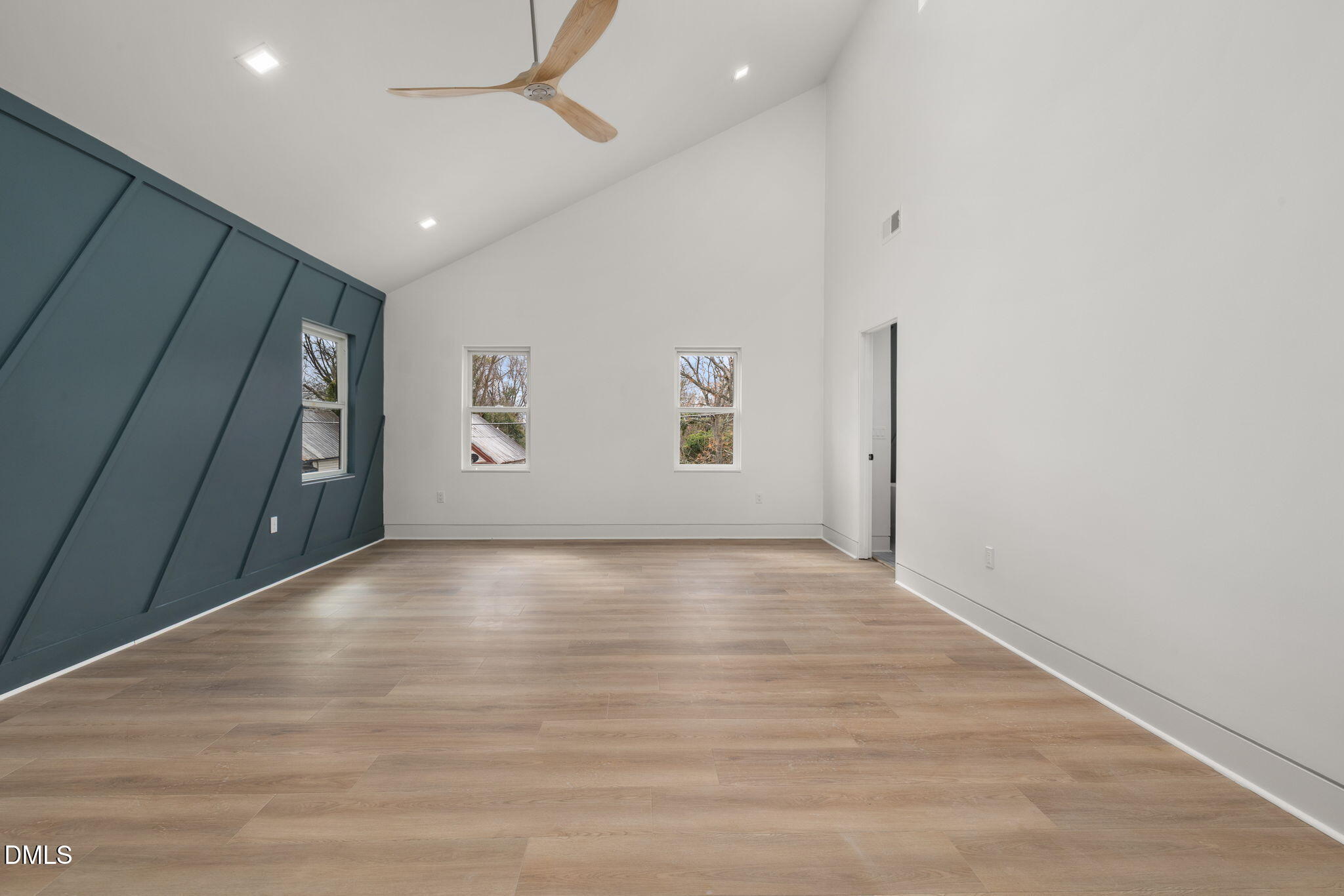 309 Bragg Street Raleigh, NC 27601 - Photo 27 of 55 a view of an empty room with window and wooden floor