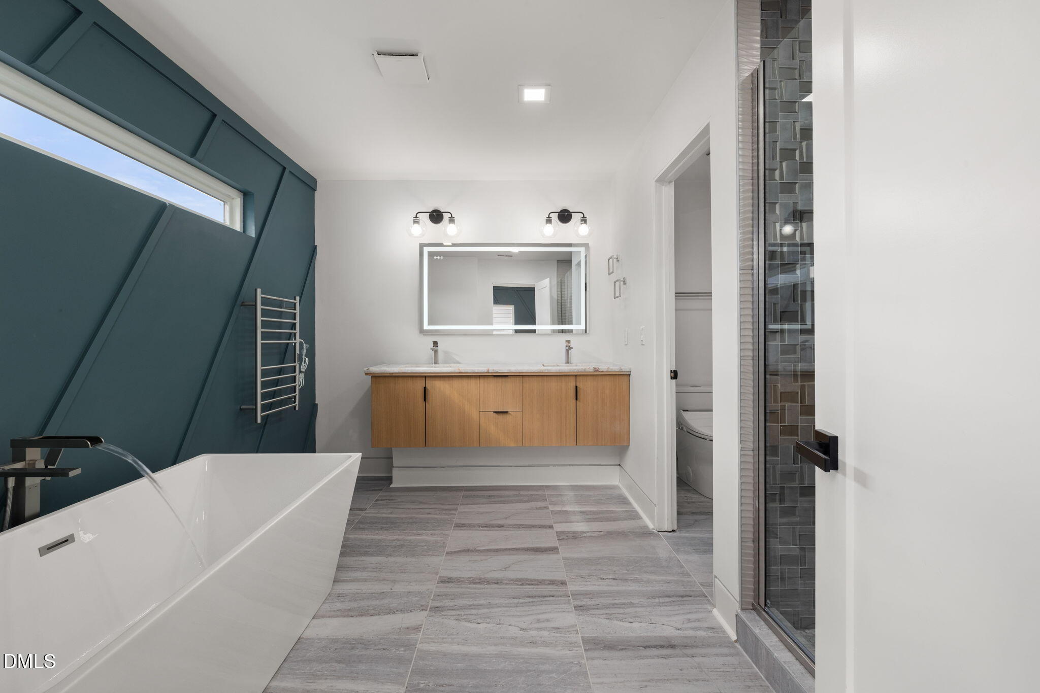 309 Bragg Street Raleigh, NC 27601 - Photo 28 of 55 a bathroom with a tub sink and mirror