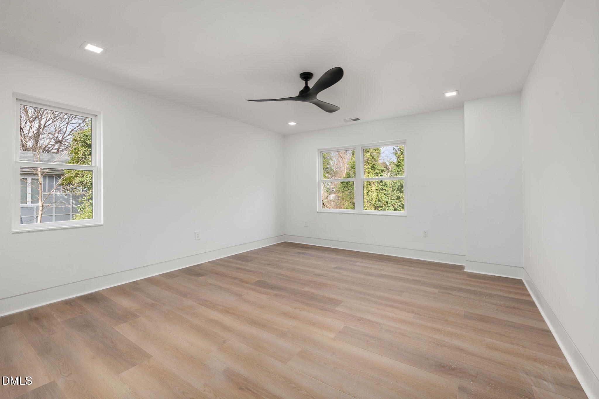 309 Bragg Street Raleigh, NC 27601 - Photo 35 of 55 wooden floor in an empty room with a window